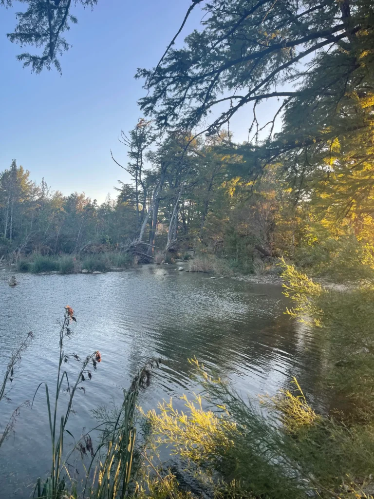 Families enjoying spring break camping along the banks of the Frio River.